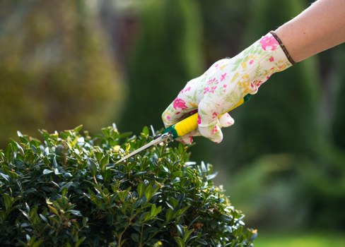 Gardeners working carefully in a Monken Hadley garden setting