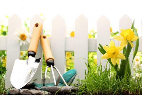 Seasonal lawn maintenance in Monken Hadley with healthy turf and borders
